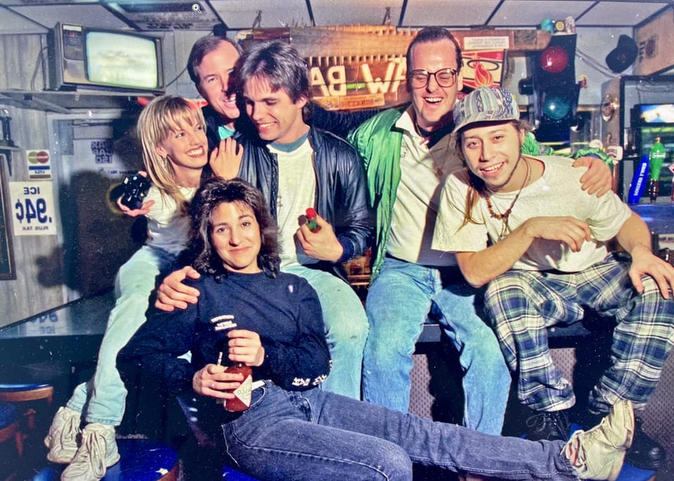 A group of people posing together in an old photo