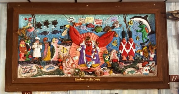 King Lobster & His Court, a framed sculpted ceiling tile full of sea creatures