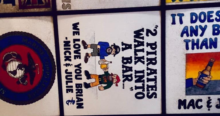 Personalized ceiling tiles, one reading “2 Pirates walk into a bar…”