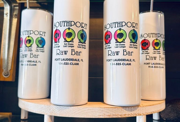 White Southport Raw Bar tumblers with the fish, clam and oyster badges