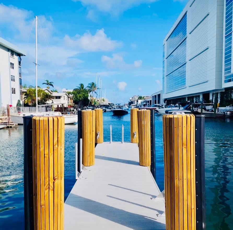 The dock and its yellow pilings leading out to the canal
